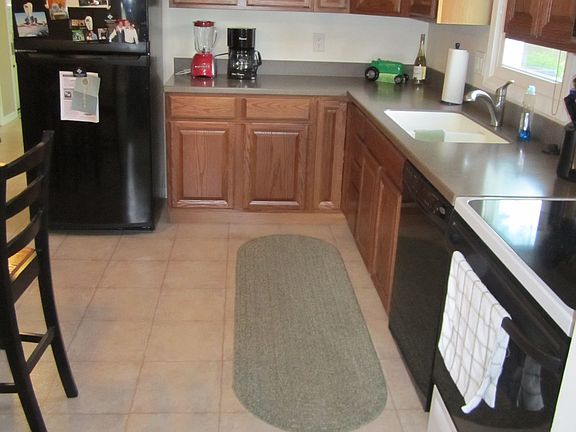 Spacious Kitchen with Stove, Microwave, Dishwasher, and Refrigerator