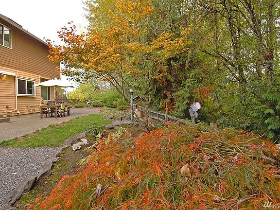 VERY private - as if you had NO neighbors.  Green belt and no neighbors can see in your private backyard. Nicely poured patio. Easy care yard - don't forget to look at the  large side yard!!!