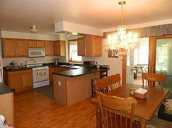 Oak cabinet filled kitchen and all the appliances stay.