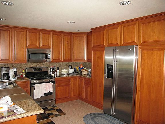 Custom kitchen. Granite counter tops, stainless steel appliances.