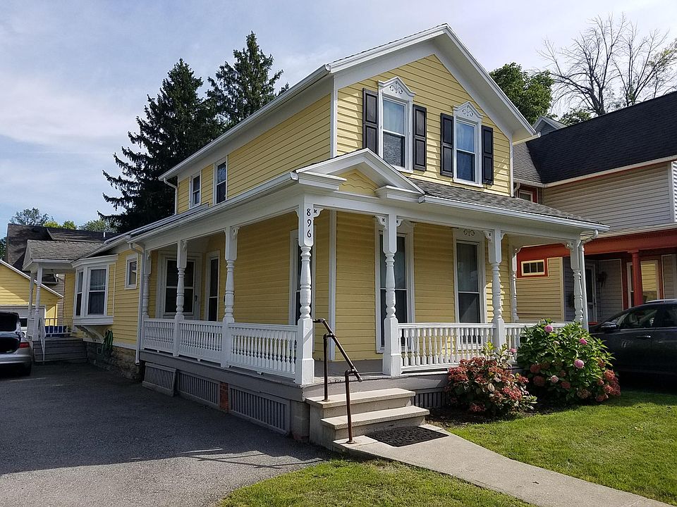 Classic 19th century home with wrap around front porch.