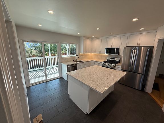 Beautifully renovated kitchen with brand new stainless steel appliances, and large island.