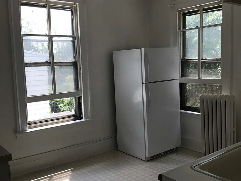 Kitchen with refrigerator