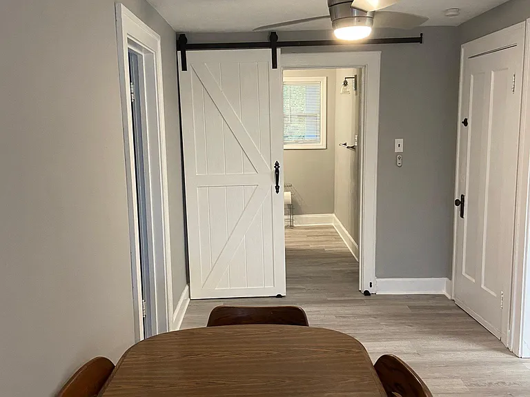 living/dining room combination looking toward bathroom
