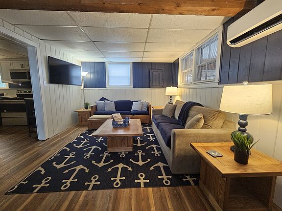 Living Room with 50 inch Smart TV that offers Samsung Plus and a heating and cooling pump.