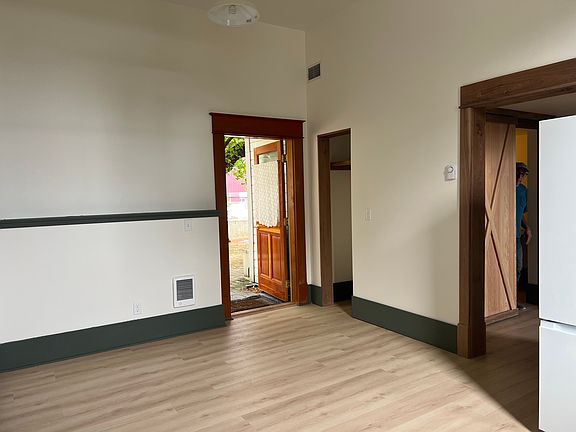 living -kitchen is one room with door to courtyard.