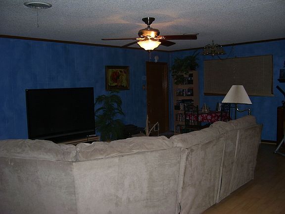 Living room and dining room with kitchen area to the right