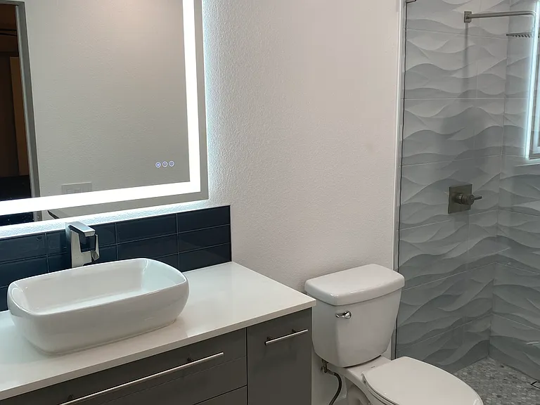 Ensuite master bath JUST completely rebuilt with zero entry rain head shower.