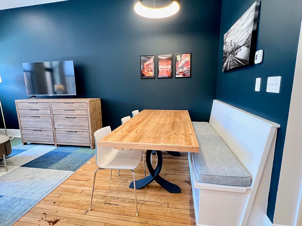 Dining area with banquette seating, seats 6 easily.