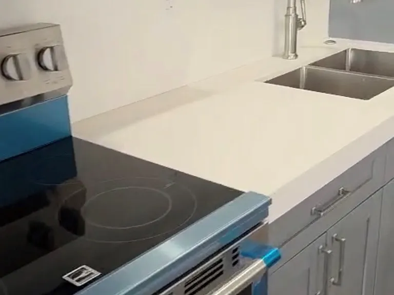 Quartz Counter Top, Double Sink, Handheld faucet with extendable Hose