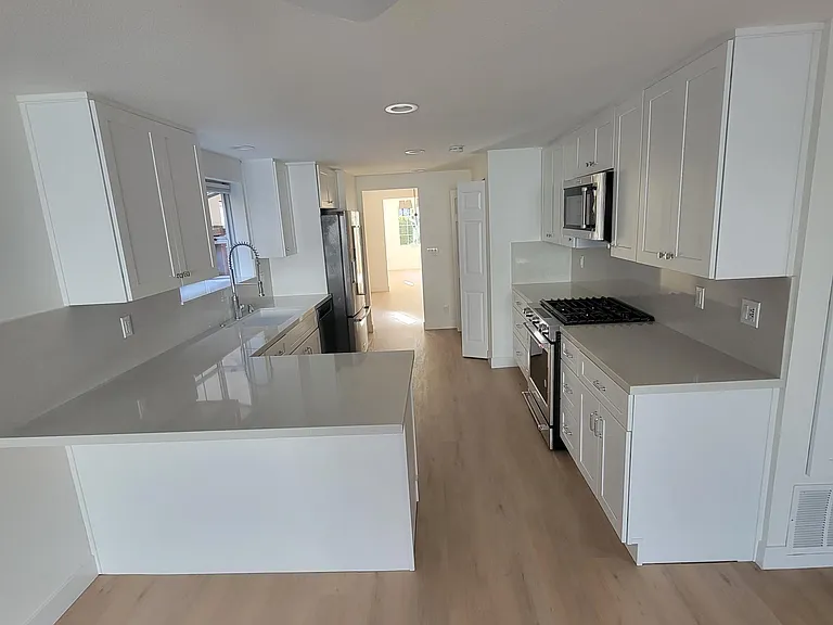Kitchen with all new cabinets and all new Kitchen Aid appliances.