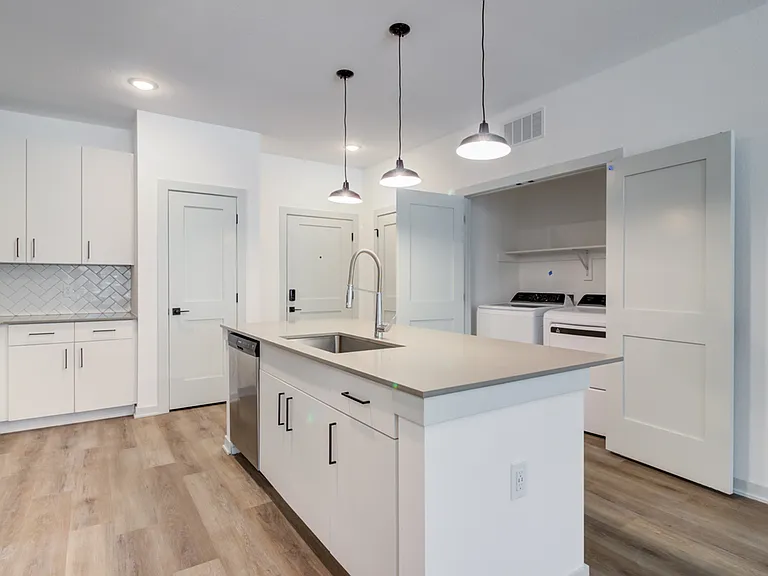 A stainless steel dishwasher, modern finishes, and full-size washer and dryer can be expected in every Garrett Forum apartment.