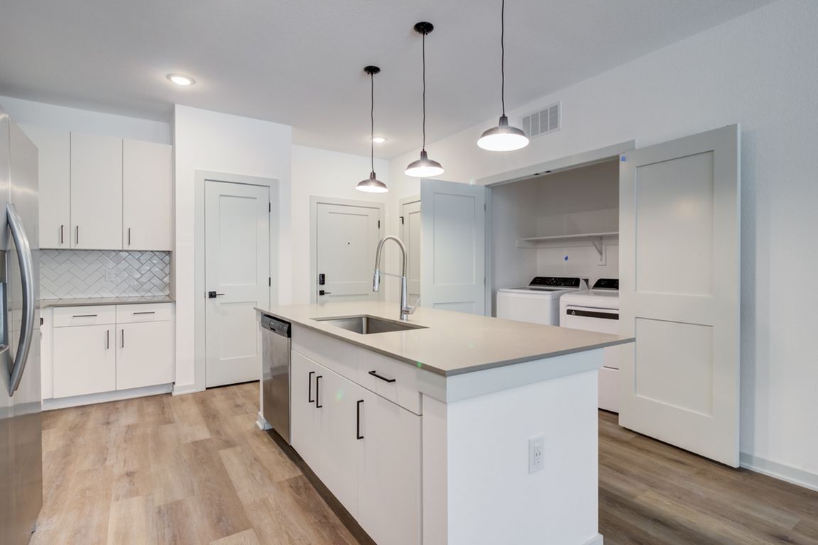 A stainless steel dishwasher, modern finishes, and full-size washer and dryer can be expected in every Garrett Forum apartment.