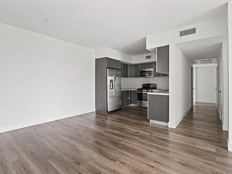 Open-Concept Kitchen and Dining Space with Vinyl Flooring