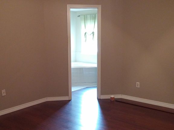 Master bedroom and entrance to bathroom