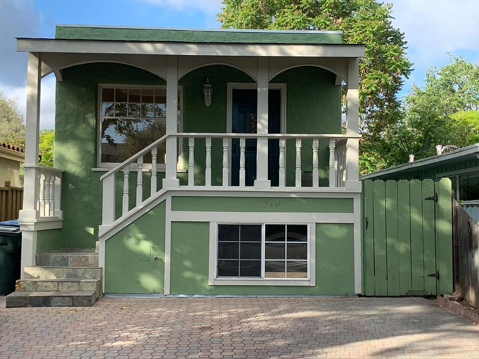 Front of the two-story house with driveway parking for two cars.