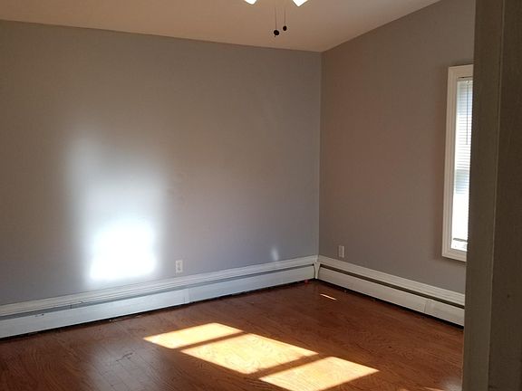New floors, and ceiling fan newly painted walls