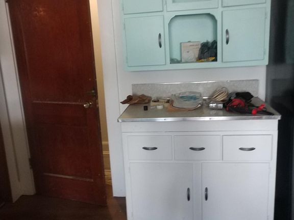 Door to basement from kitchen....Hoosier cabinet