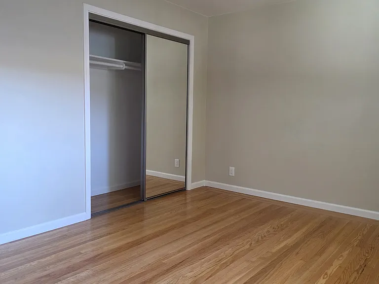 Large Bedroom facing the closet.