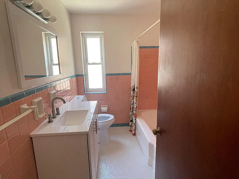 Nice size bathroom with new vanity and toilet.