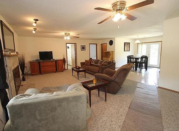 View great room looking into breakfast area and doors to 2 bedroom and bath