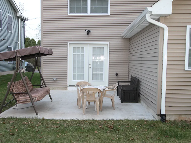 Backyard with patio set _ perfect for relaxing outdoors.