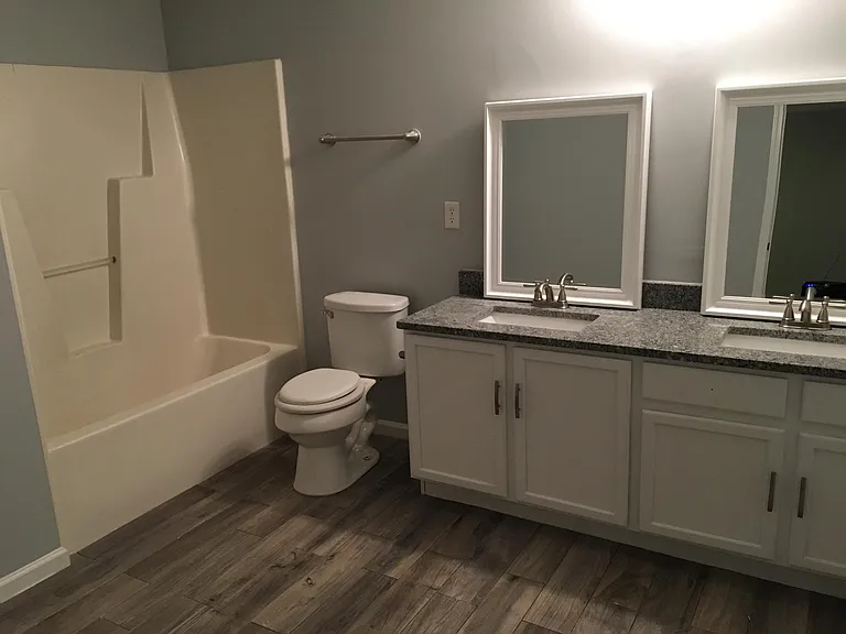 Master bath with new granite, hardware, double sinks, facets
