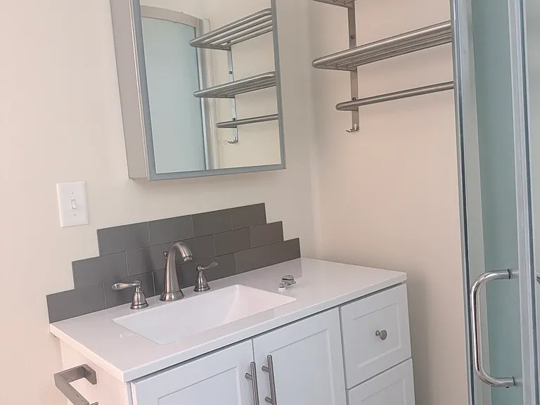 Bathroom. Medicine Cabinet with light that can be heated or not. There is also an overhead light with fan.