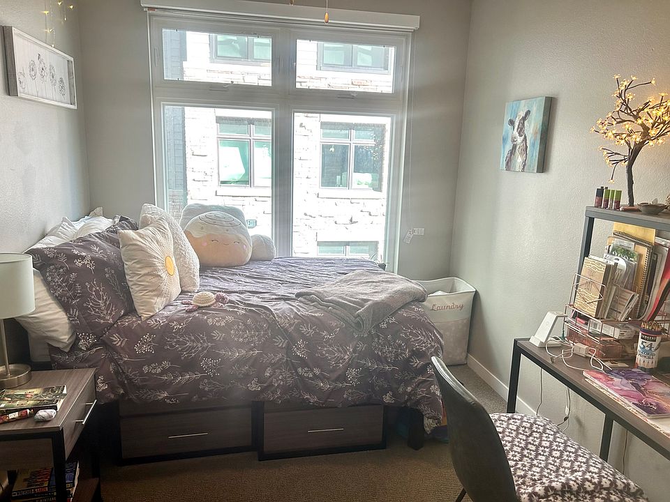 Fully furnished bedroom with regular / double sized bed, dresser, and desk.