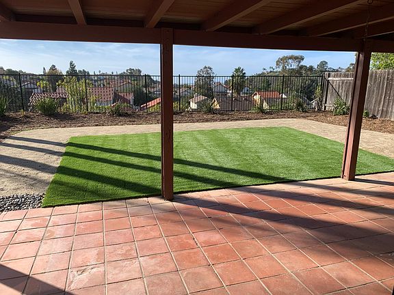 Nice sized backyard with covered patio and view