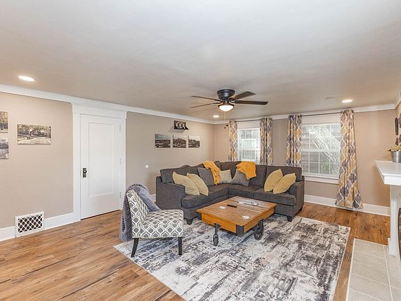 Large spacious living area with lots of natural light and room darkening curtains.