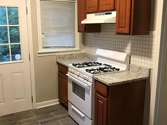 Right outside of the kitchen is a fenced in area for kids or pets, new stainless steel appliances to be installed.