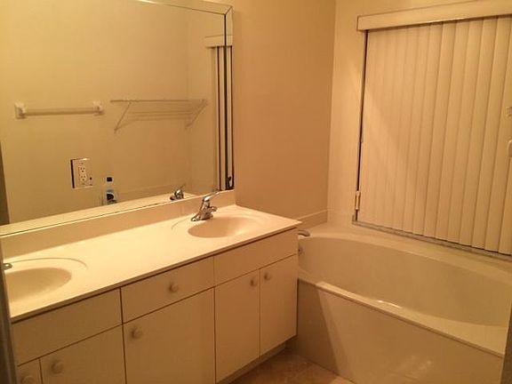 master bathroom with bath tub and shower