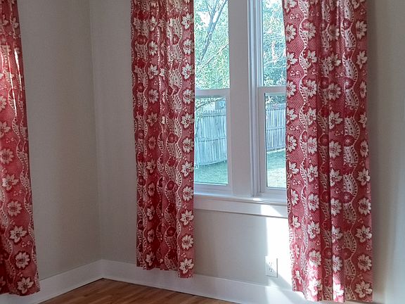 Bedroom 1, curtain rods stay for your convenience.