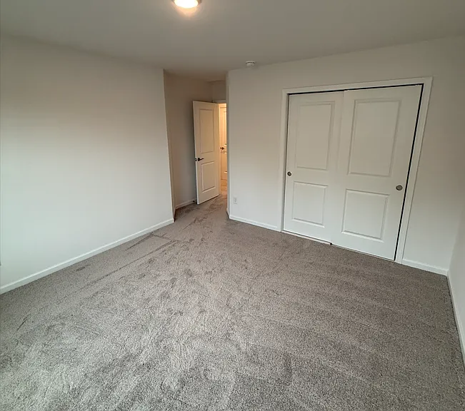 guest bedroom downstairs with full bathroom