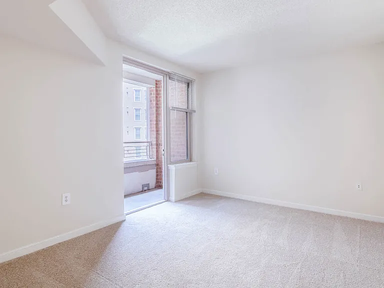 Carpeted Bedroom with Balcony