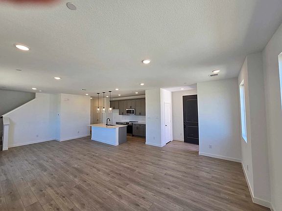 Open Kitchen-Living-Dining Room Construction Progress featuring the Minimalist Collection