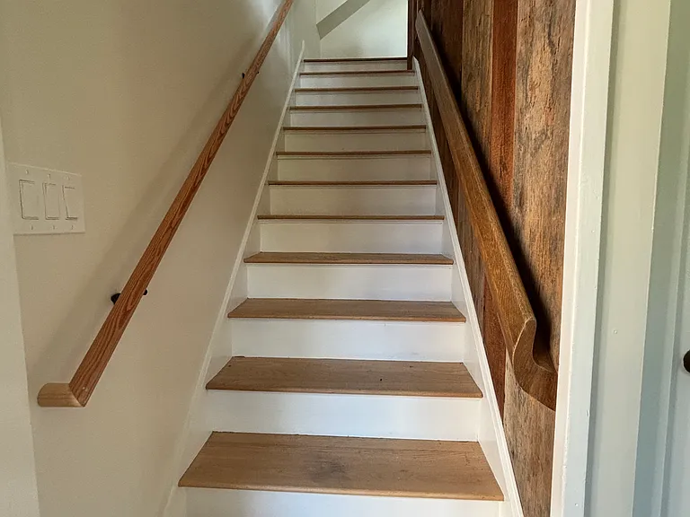 Downstairs: entry, stairs going up
