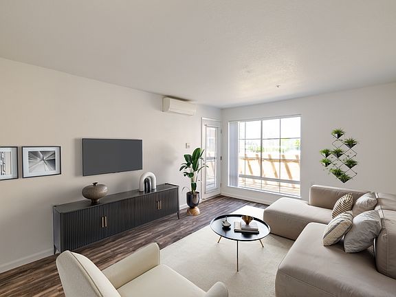 Airy living room with warm, modern finishes.