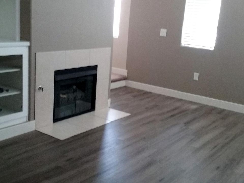 Fireplace & built-in media center / new plank flooring