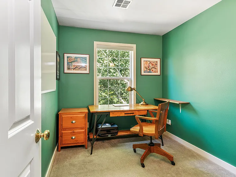 Upstairs office, or itty bitty 4th bedroom. Faces out the back of the house.