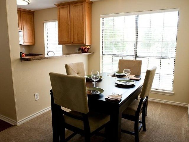 Kitchen overlooks spacious dining room