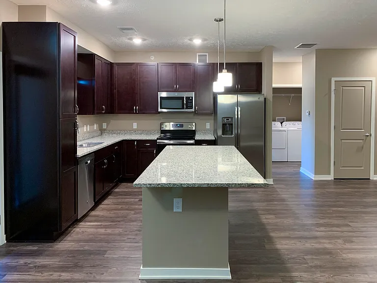 Cook and connect in our modern kitchens with granite countertops, sleek cabinetry, and plenty of room for meal preparation.