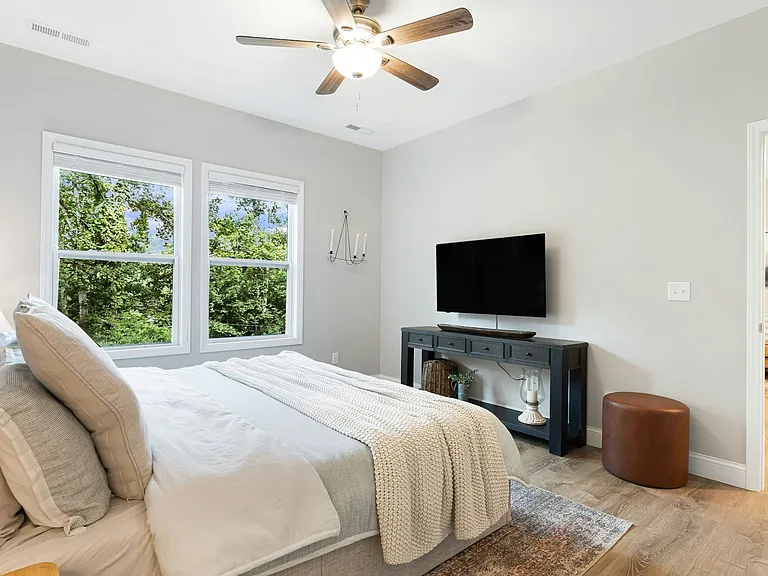 Perspective from primary bath back into bedroom