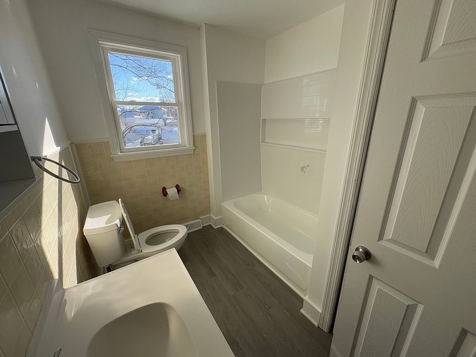 Updated bathtub with new fixtures