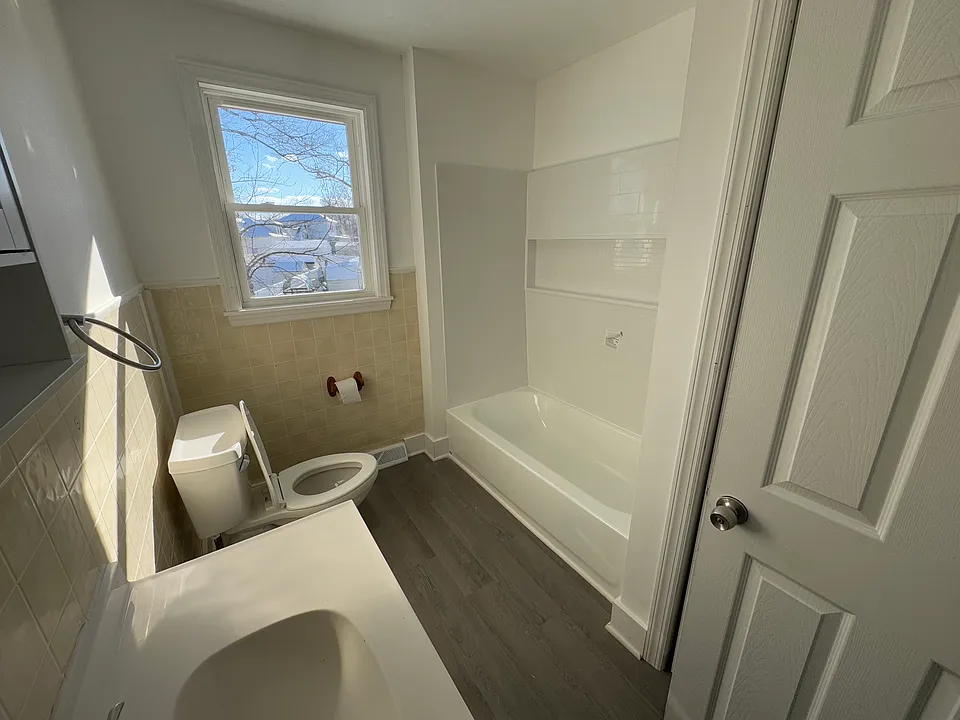 Updated bathtub with new fixtures