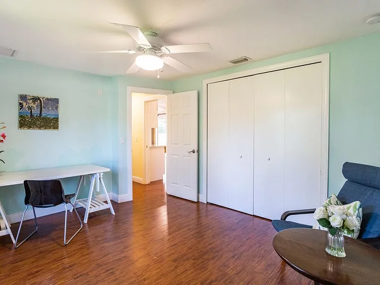 Den/office with view of hallway