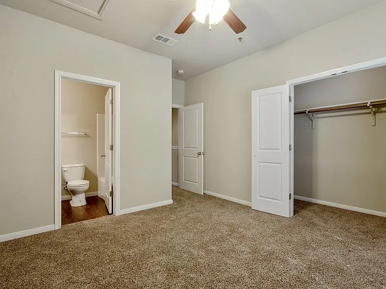 upstairs bedroom with carpet ceiling fan and on suite bathroom upstairs bedroom with carpet ceiling fan and on suite bathroom