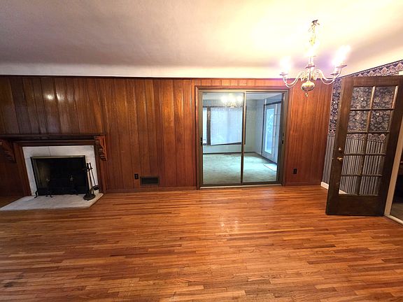 Living room and dining room leading in to enclosed heated porch
