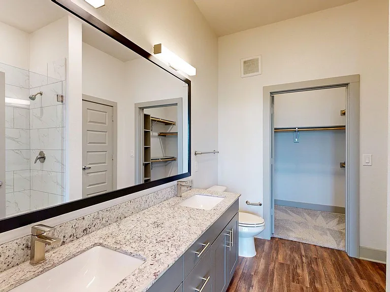 Apartment Bathroom with large soaking tub and Tile Floor.
